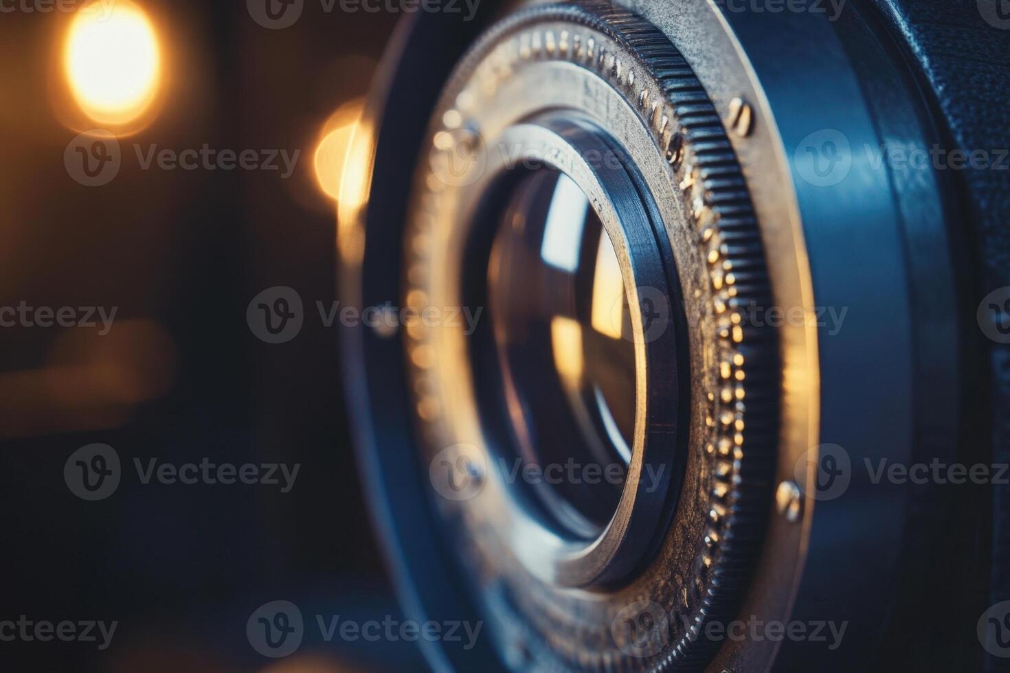 Closeup of an old camera lens with a blurry light in the background. photo