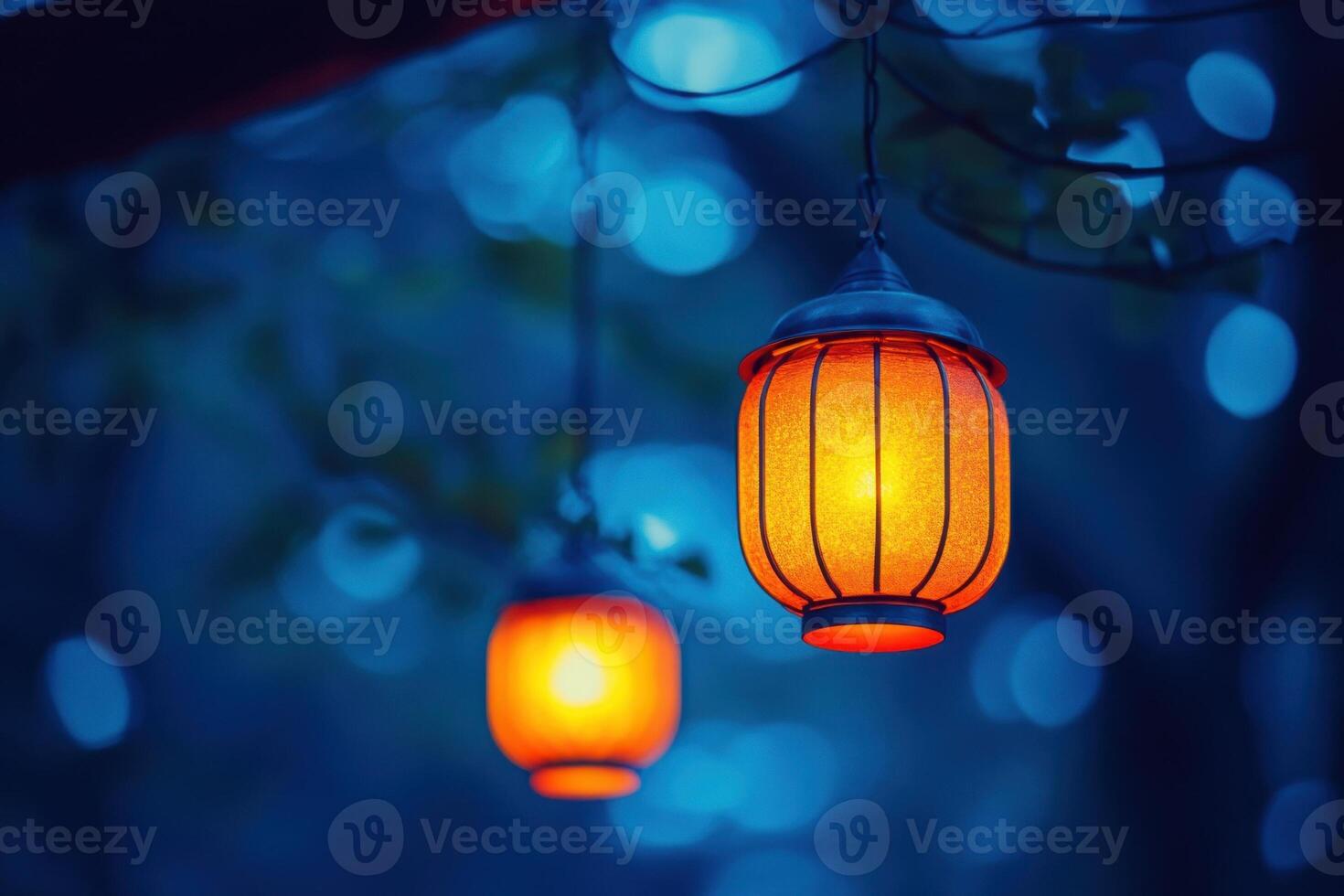 Warm Lanterns Hanging in a Blue Evening. photo