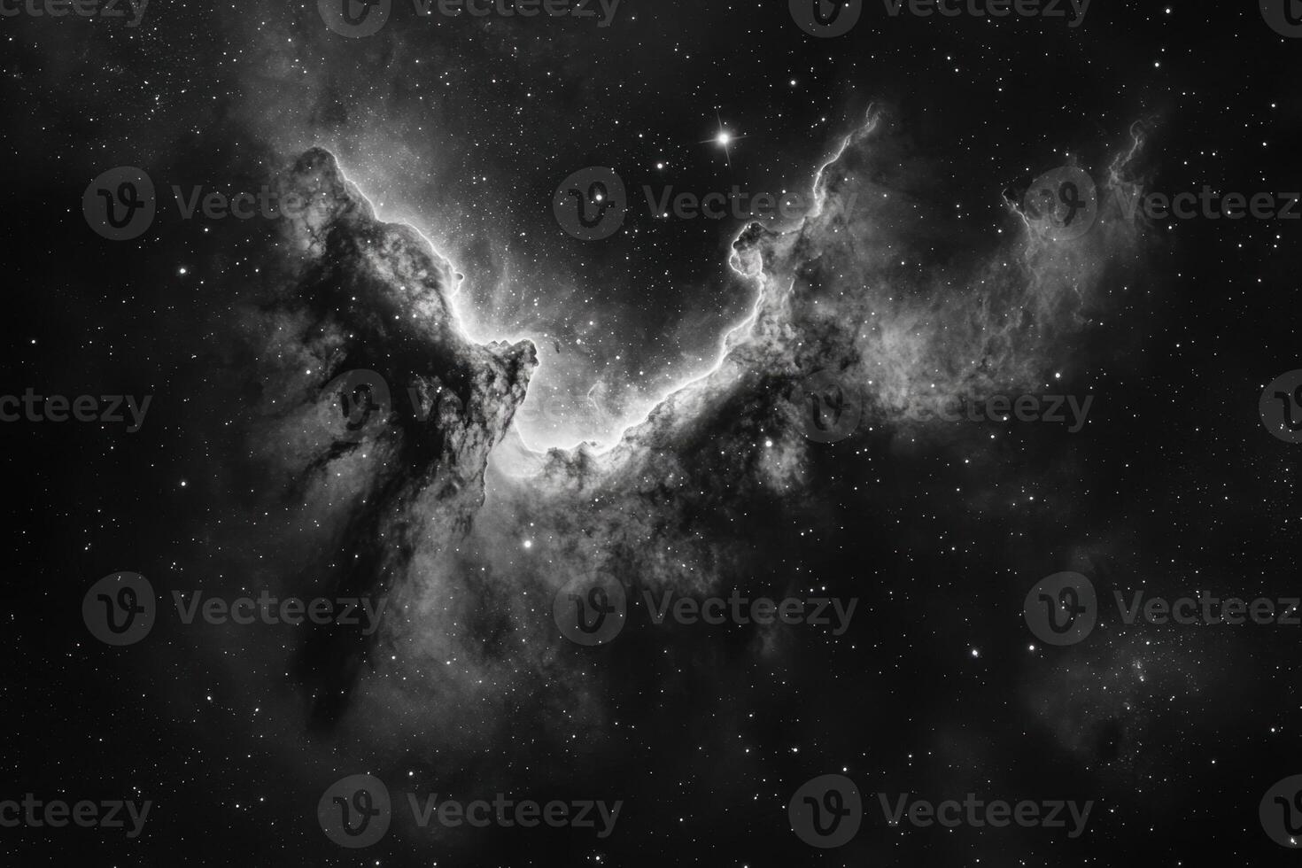 A black and white photograph of the Horsehead Nebula, a dark nebula in the constellation Orion. photo