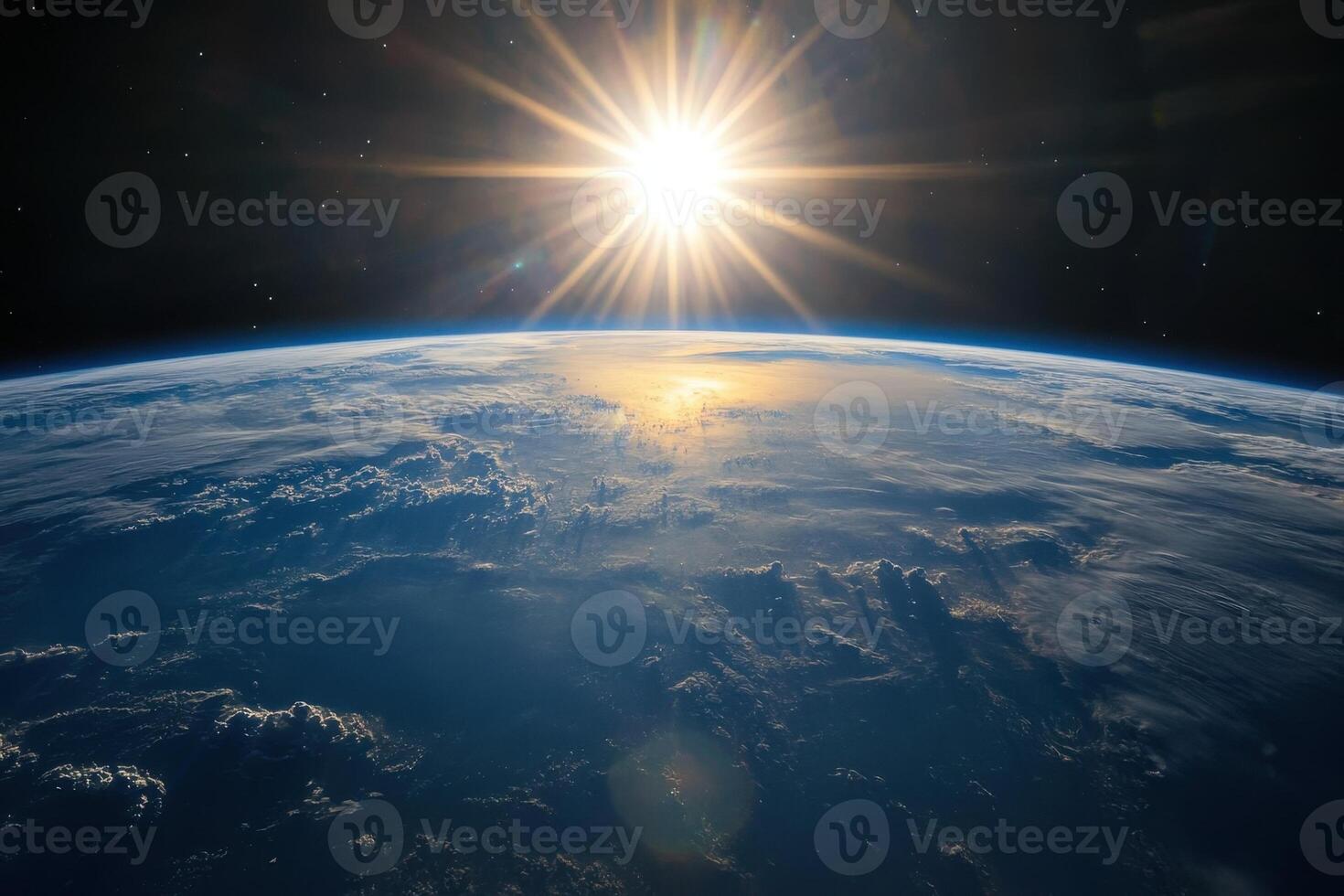A bright, shining sun rises over the Earth, casting its light on the planet's clouds and atmosphere. photo