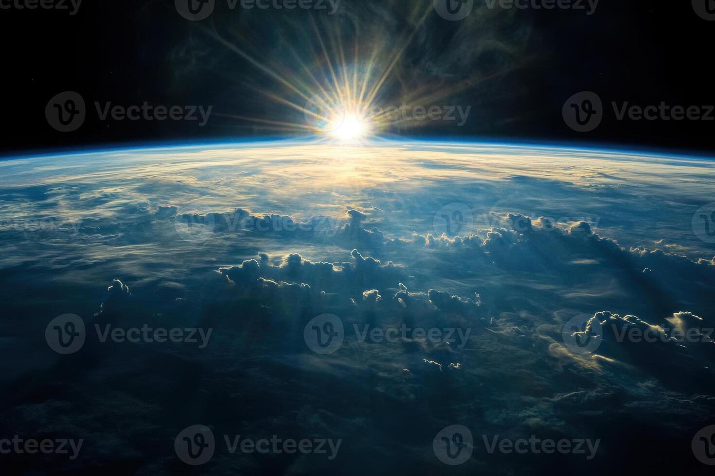 A stunning sunrise over Earth as seen from space. The sun's rays pierce through the atmosphere, casting long shadows across the clouds. photo