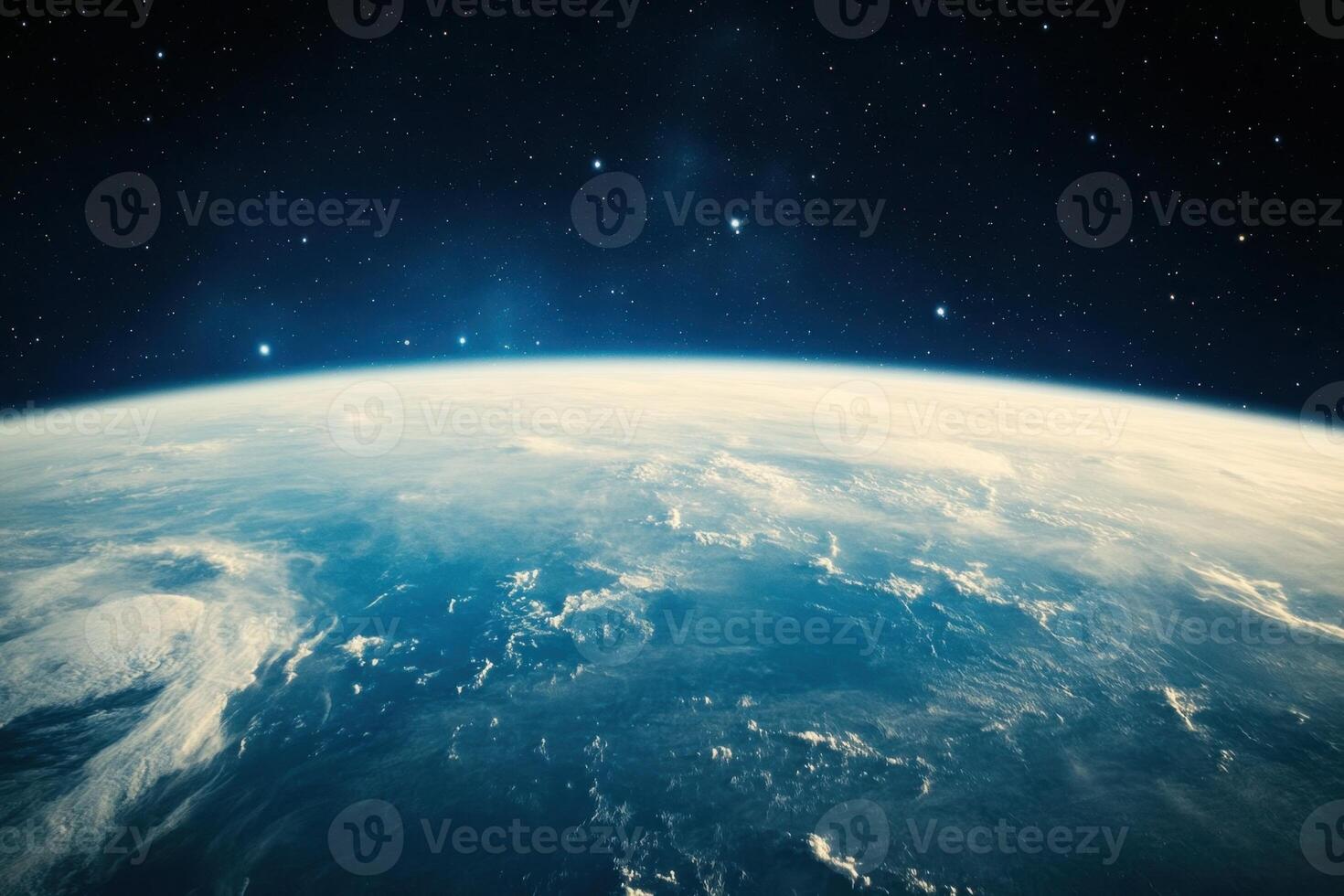 A stunning view of Earth from space, with clouds and a blue atmosphere. photo