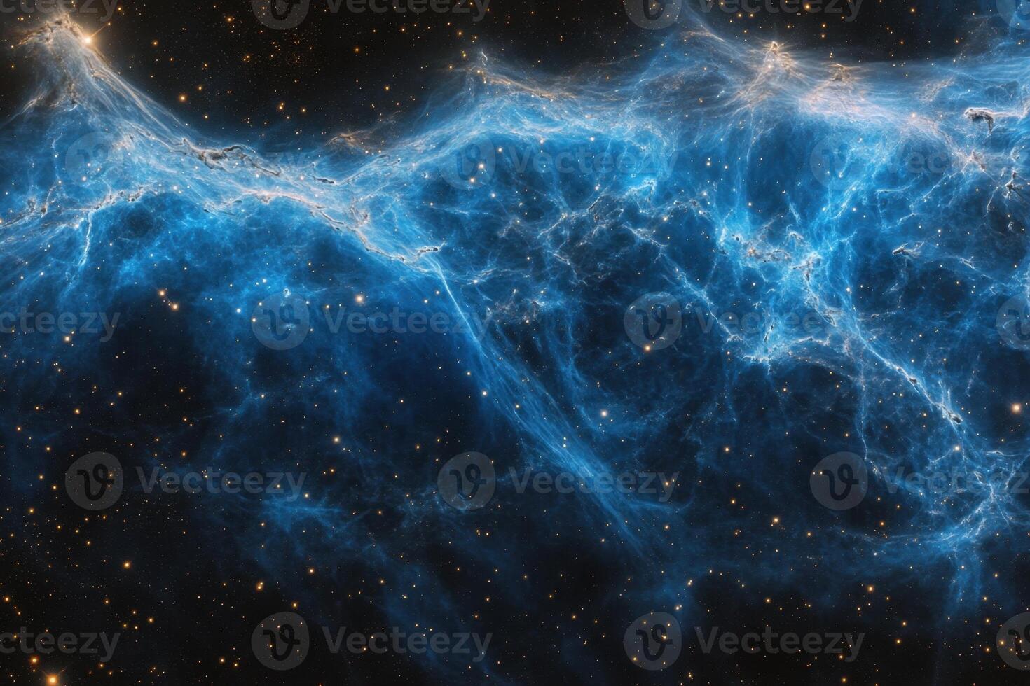 A vibrant blue nebula swirls against a backdrop of countless stars. photo