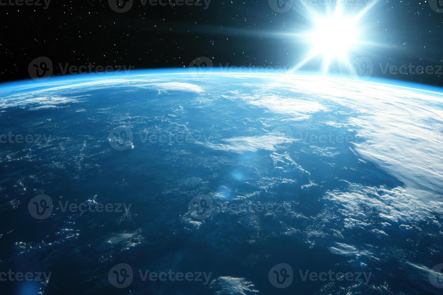 Sunrise over Earth from space, showing the planet's blue oceans, white clouds, and the sun shining brightly. photo