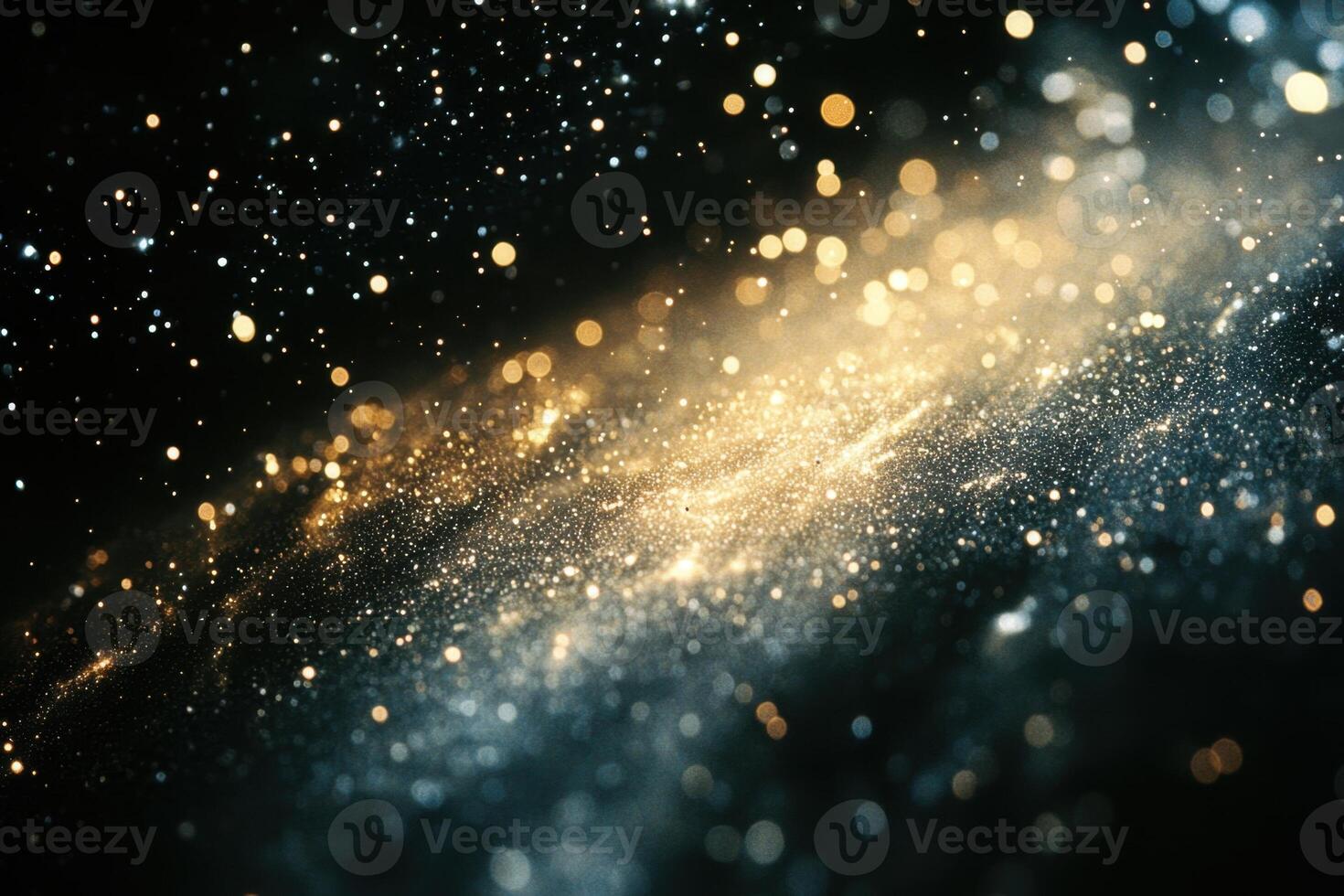 Abstract glowing galaxy with blue and gold particles on a black background. photo