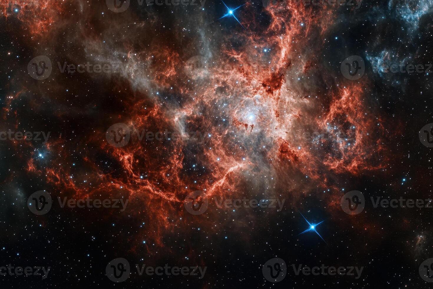A vibrant nebula glows red and orange amidst a starry backdrop. photo