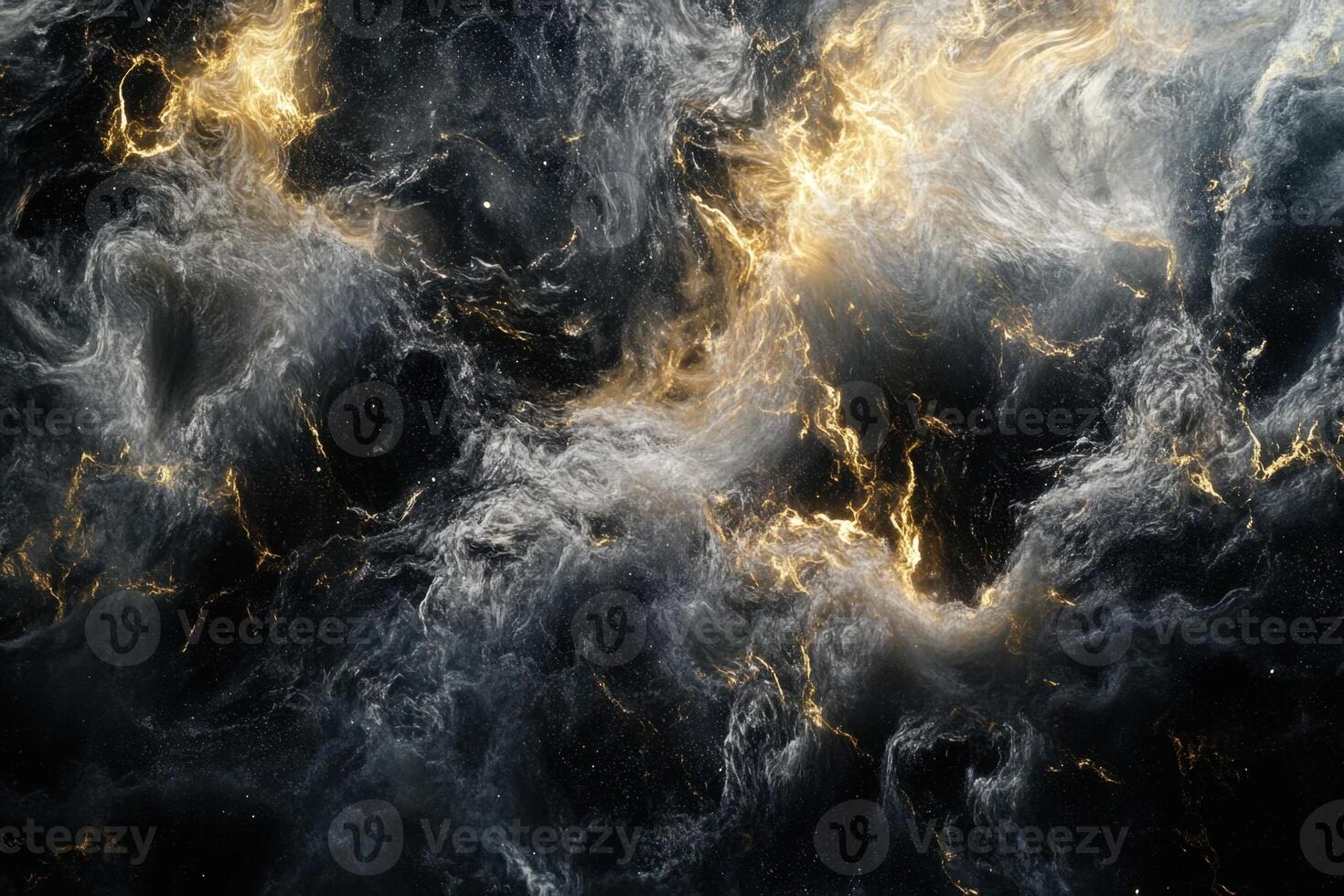 Abstract swirling clouds of smoke with golden highlights on black background. photo