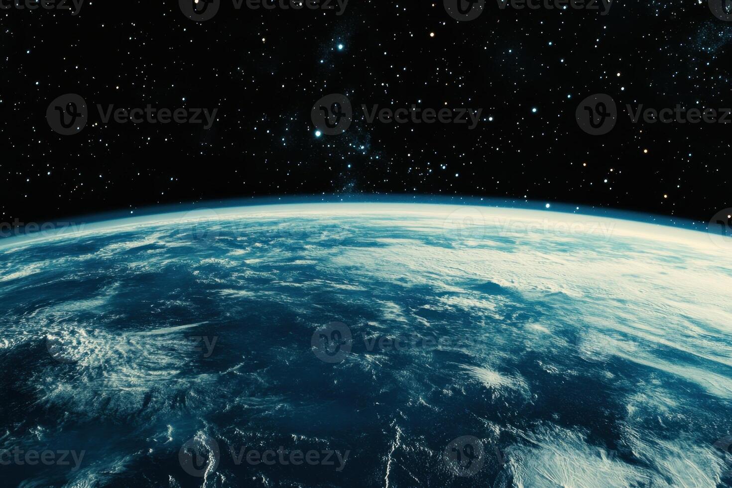 Earth from space, showing the planet's blue oceans and white clouds against a backdrop of stars. photo