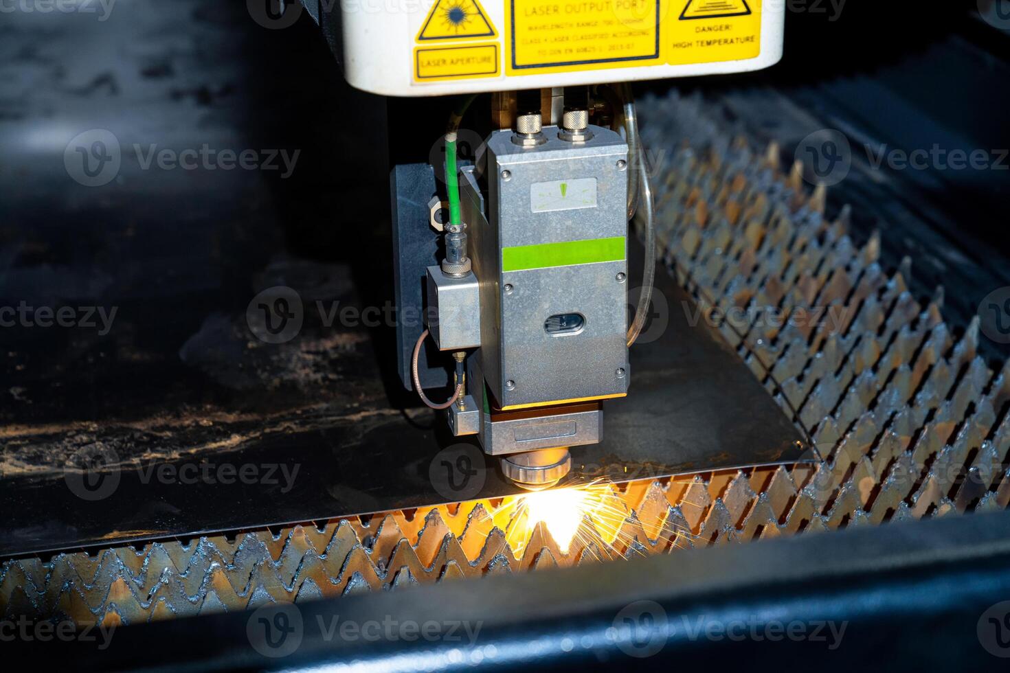 Automated robotic laser machinery. Laser metal frasing in factory. photo