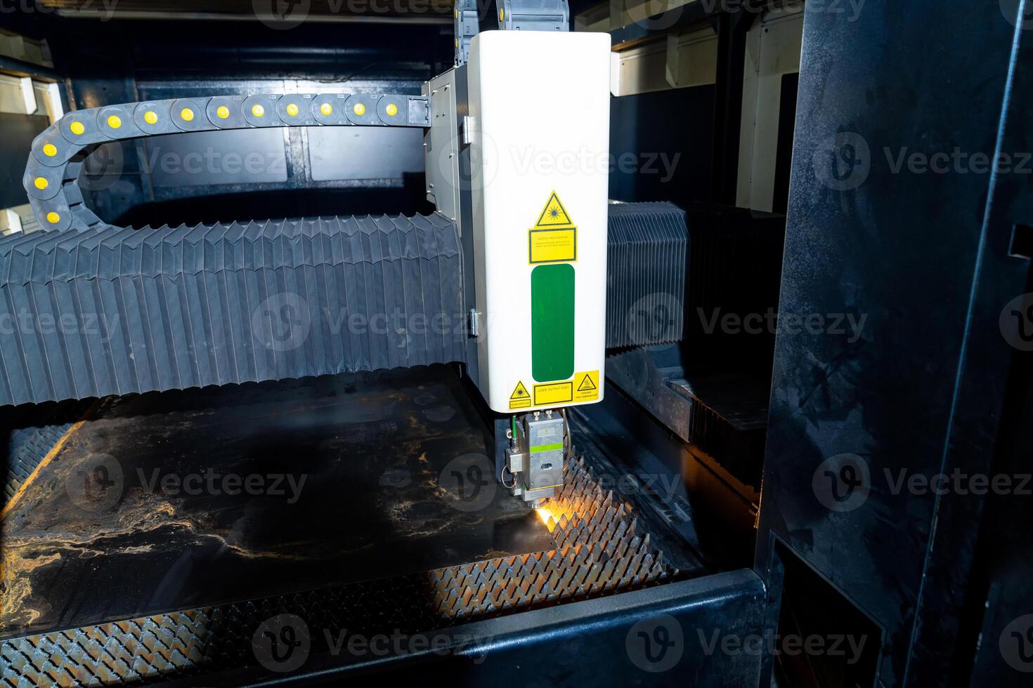 Laser metal frasing in factory. Automated robotic laser machinery. photo