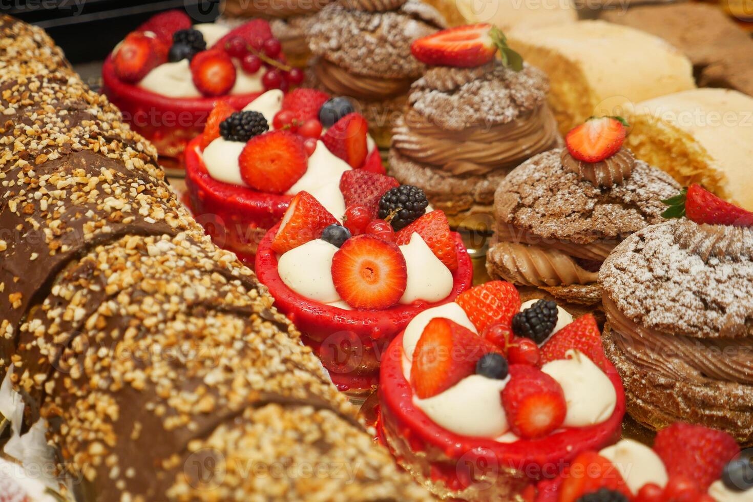 A Delicious and Tempting Assortment of Pastries and Exquisite Desserts with Fresh Fruits photo