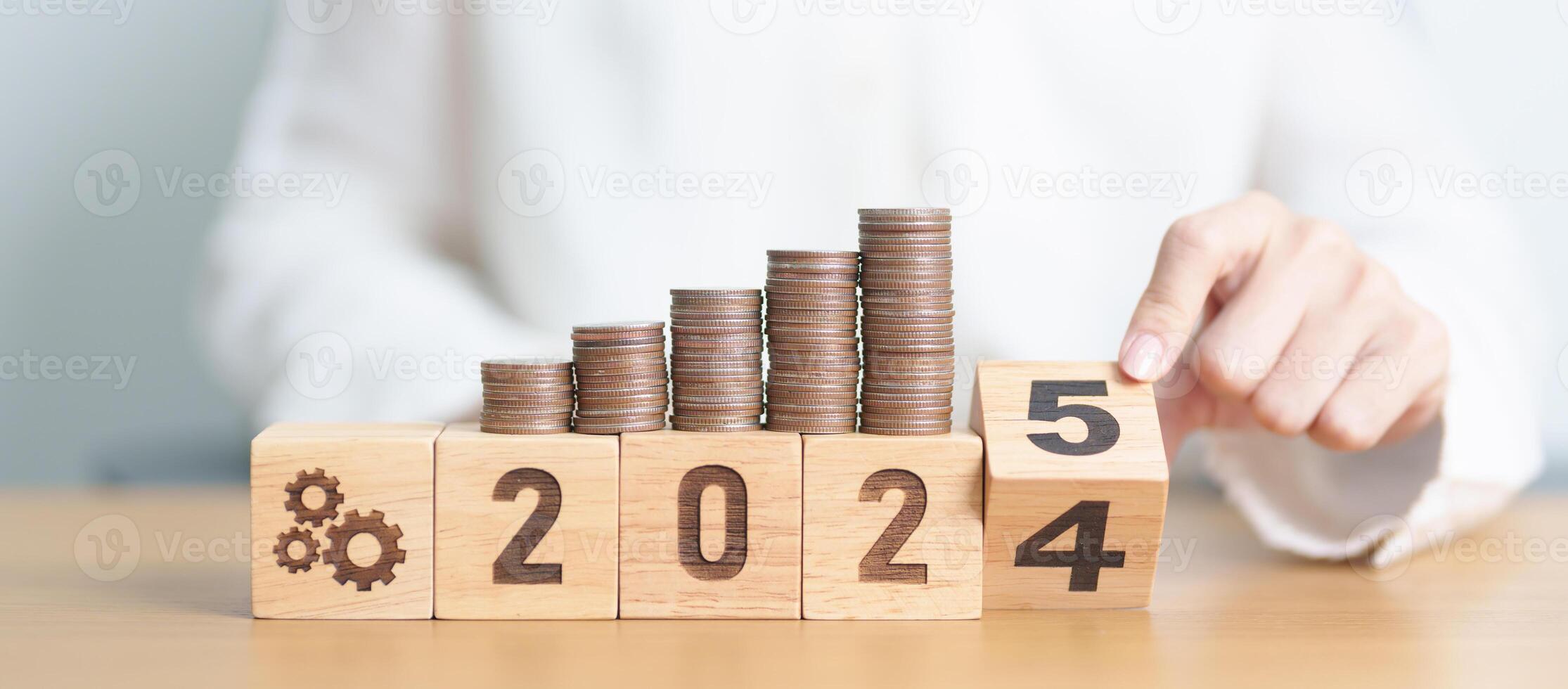 2024 end year to Happy New Year 2025 with Coins stack and gear icon. business Process, Team, teamwork, Strategy, goal, Money, Budget, investment, financial and New Year Resolution concept photo