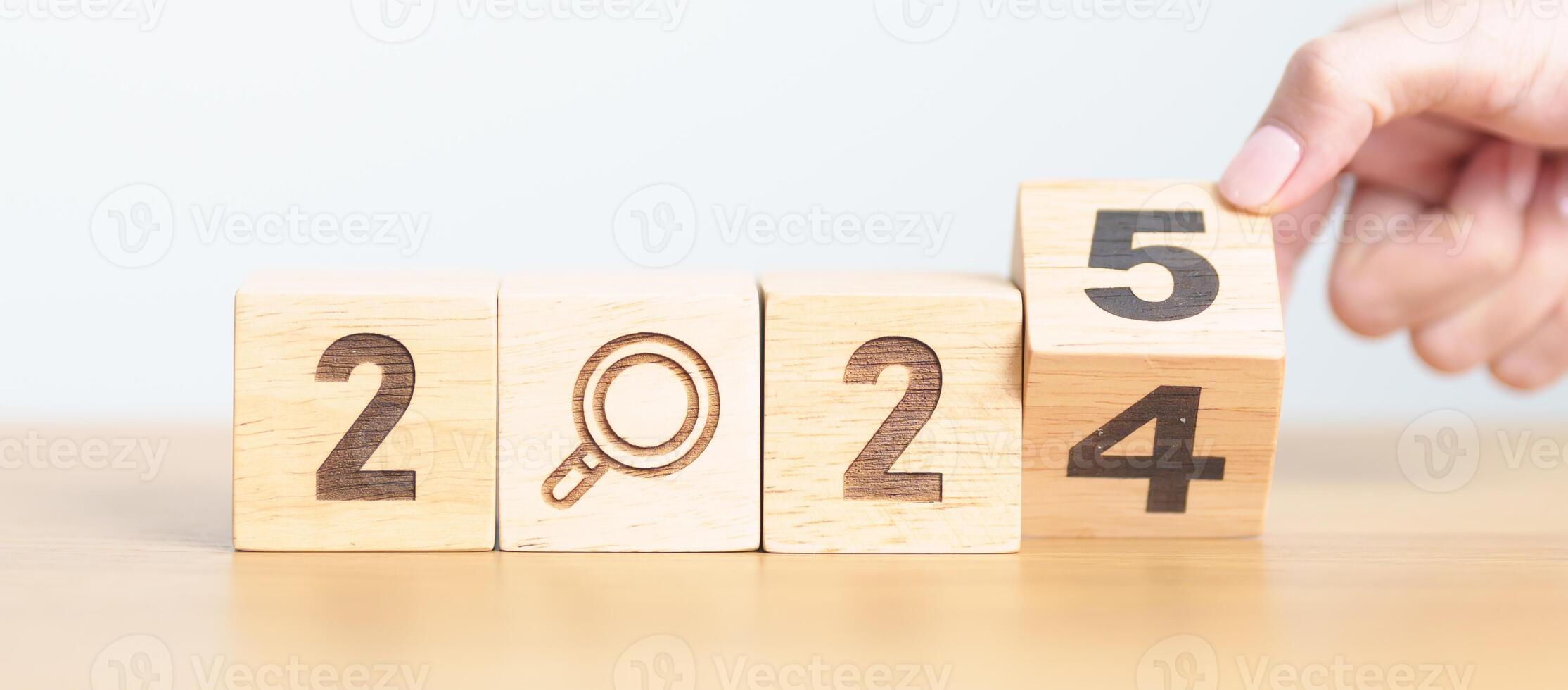 2024 year change to 2025 year block with magnifying glass icon. SEO, Search Engine Optimization, hiring , Advertising, Idea, Strategy, marketing, Keyword, Content and New Year start concepts photo