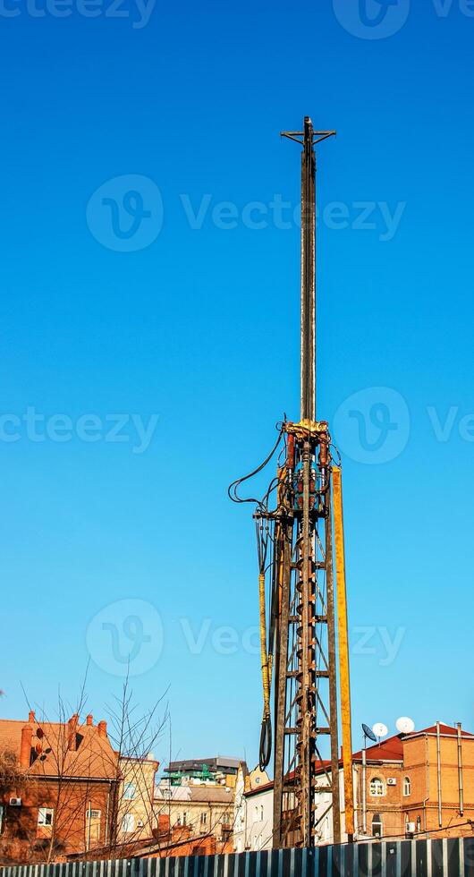Hydraulic drilling rig. Installation of bored piles with a casing string. Foundations and grounds. Drilling in the ground. technology. Machine for drilling holes in the ground. photo
