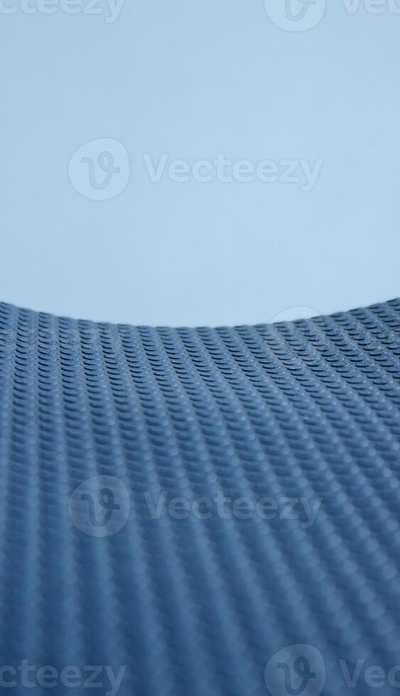 Pattern of rows of small circles on blue elastic insulation material stock photo for vertical abstract surface backgrounds