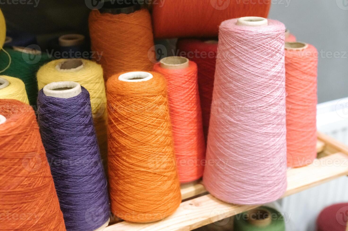 Colorful yarn cones for creative textile and craft projects photo
