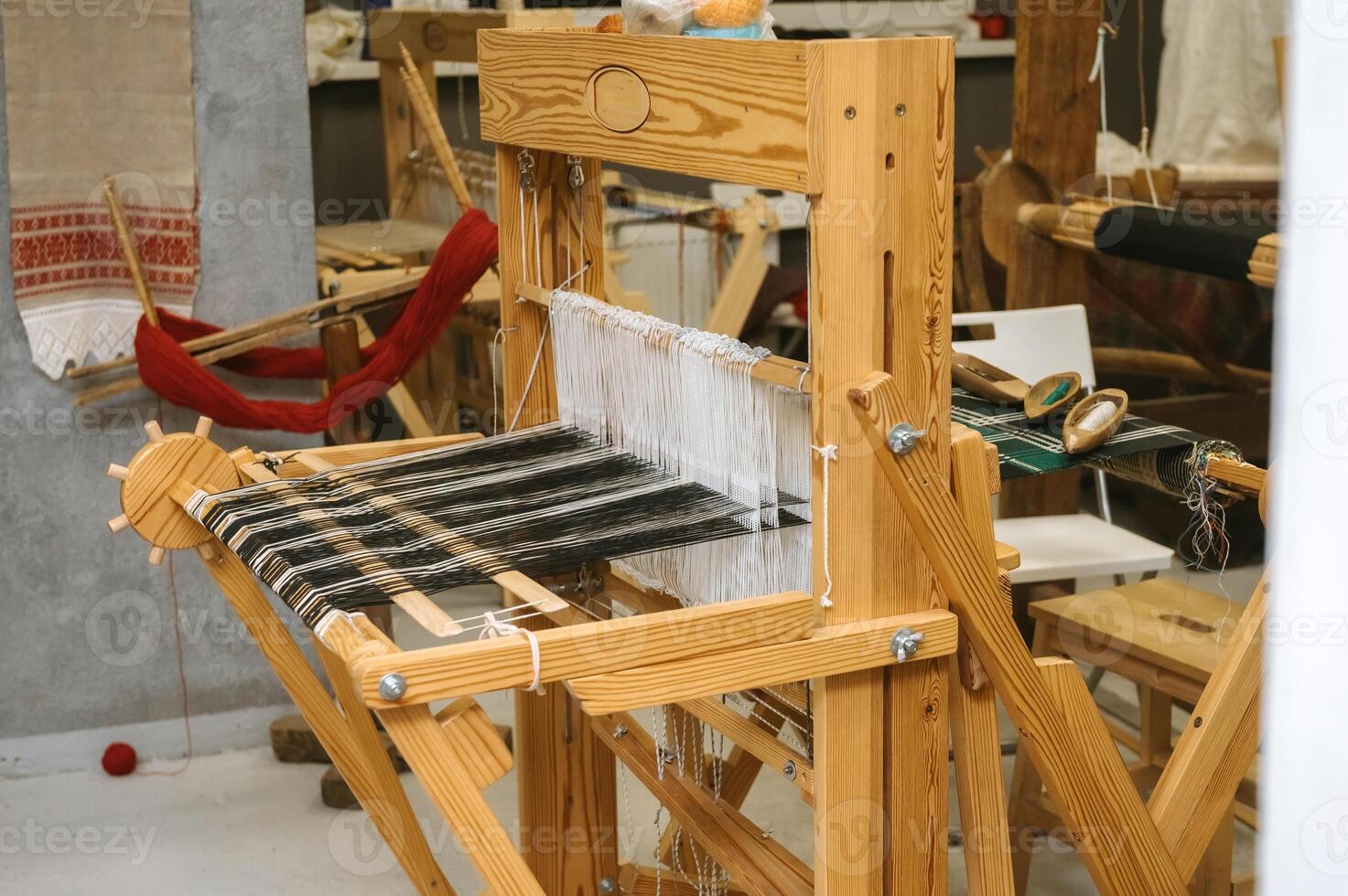 Traditional weaving loom in artisan workshop for textile crafting and design photo