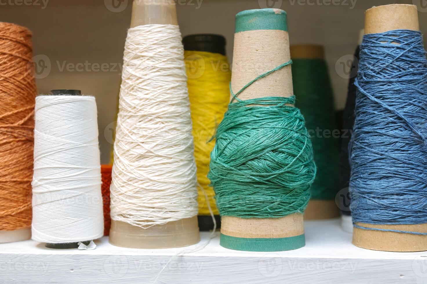 Colorful yarn cones for knitting and craft projects photo