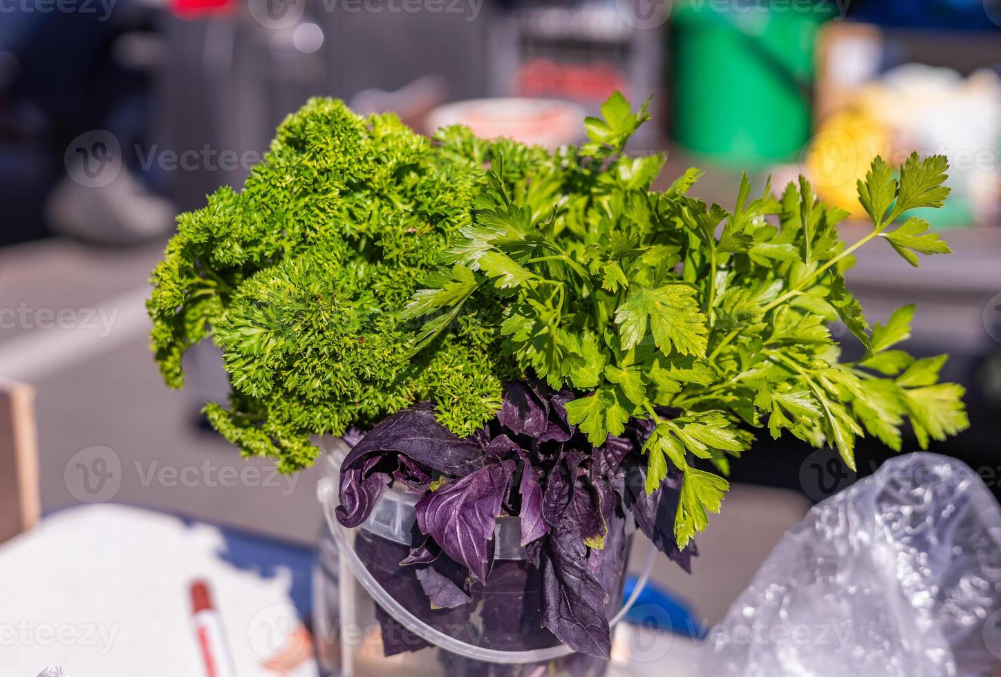 Bunch of fresh green vegetables in grocery store. Healthy lifestyle and organic vegetarian food concept. Bunches of fresh green parsley on the market counter. photo