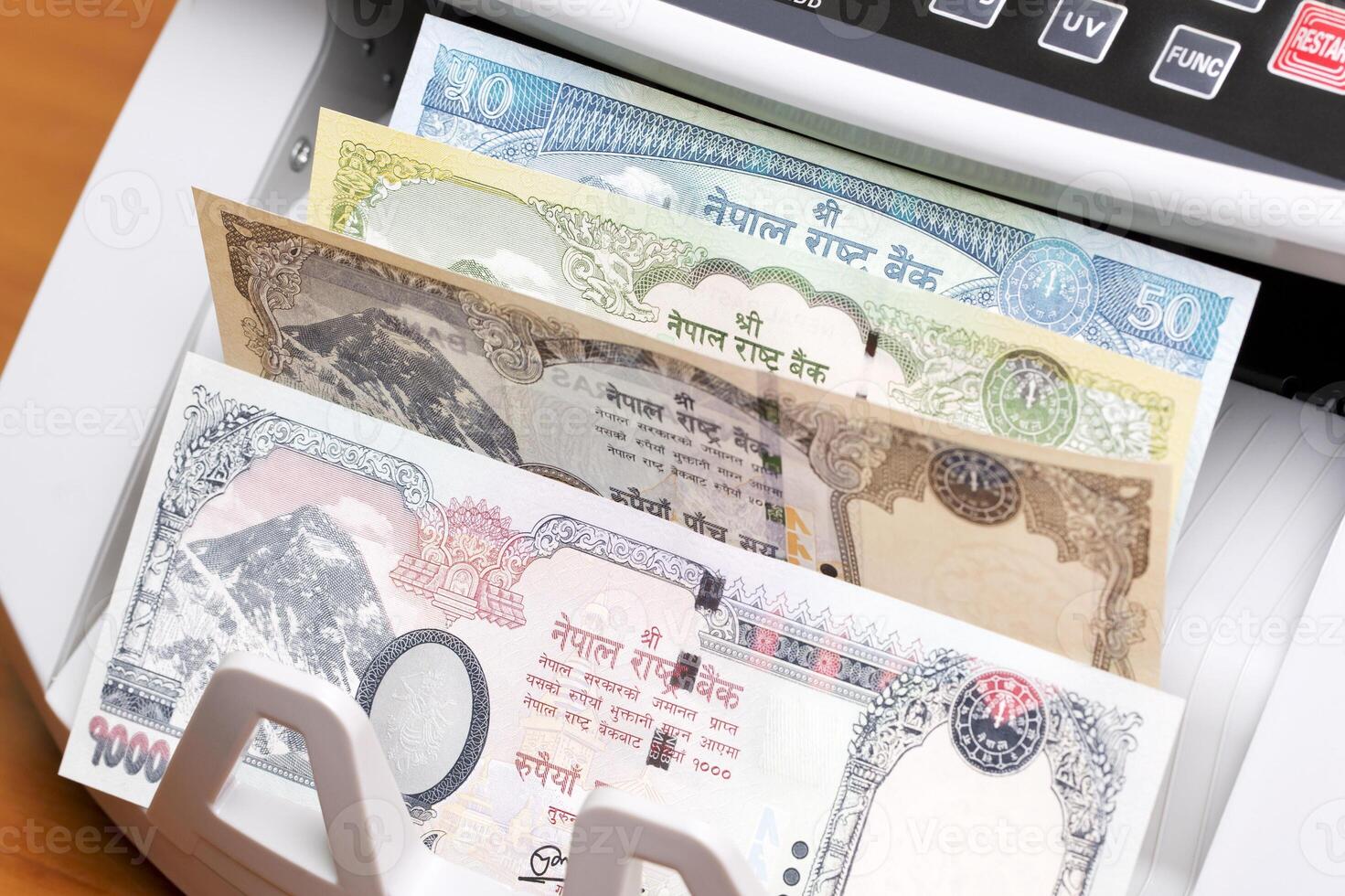 Nepalese rupee in the counting machine photo
