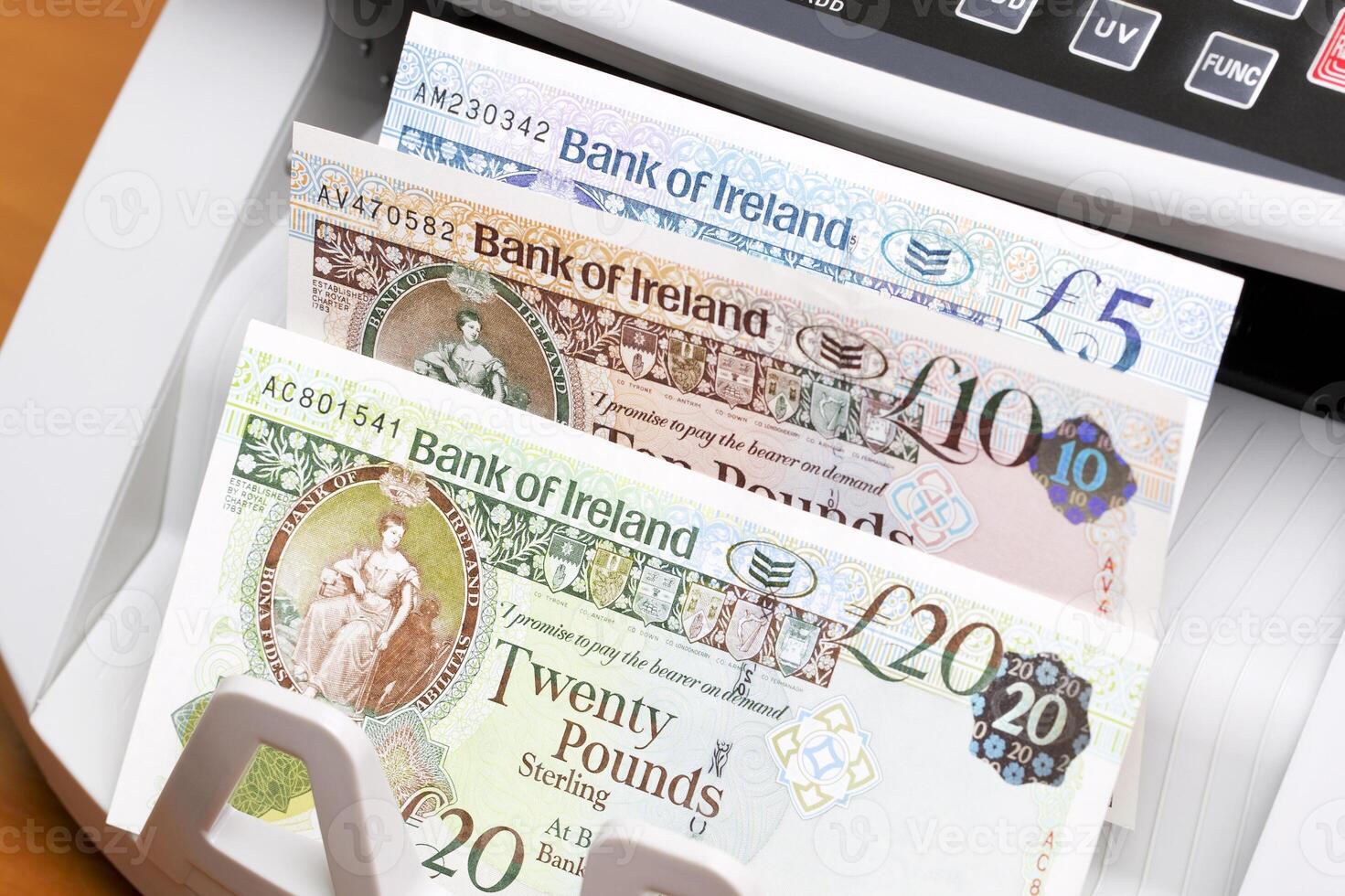 Irish pound in the counting machine photo