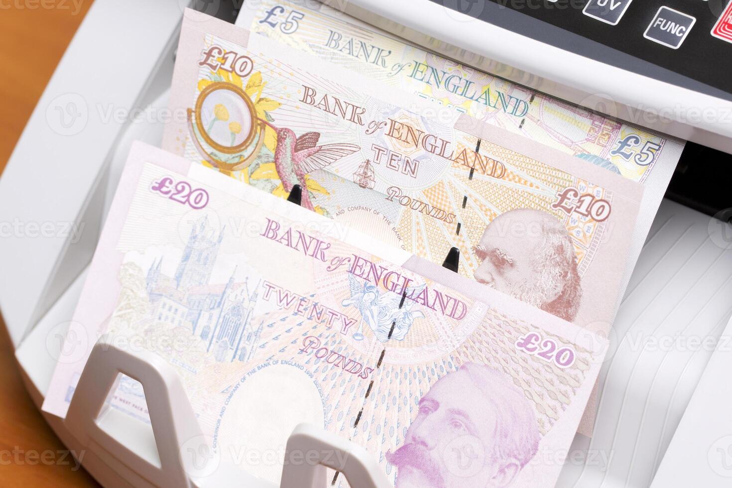 British pound in the counting machinej photo