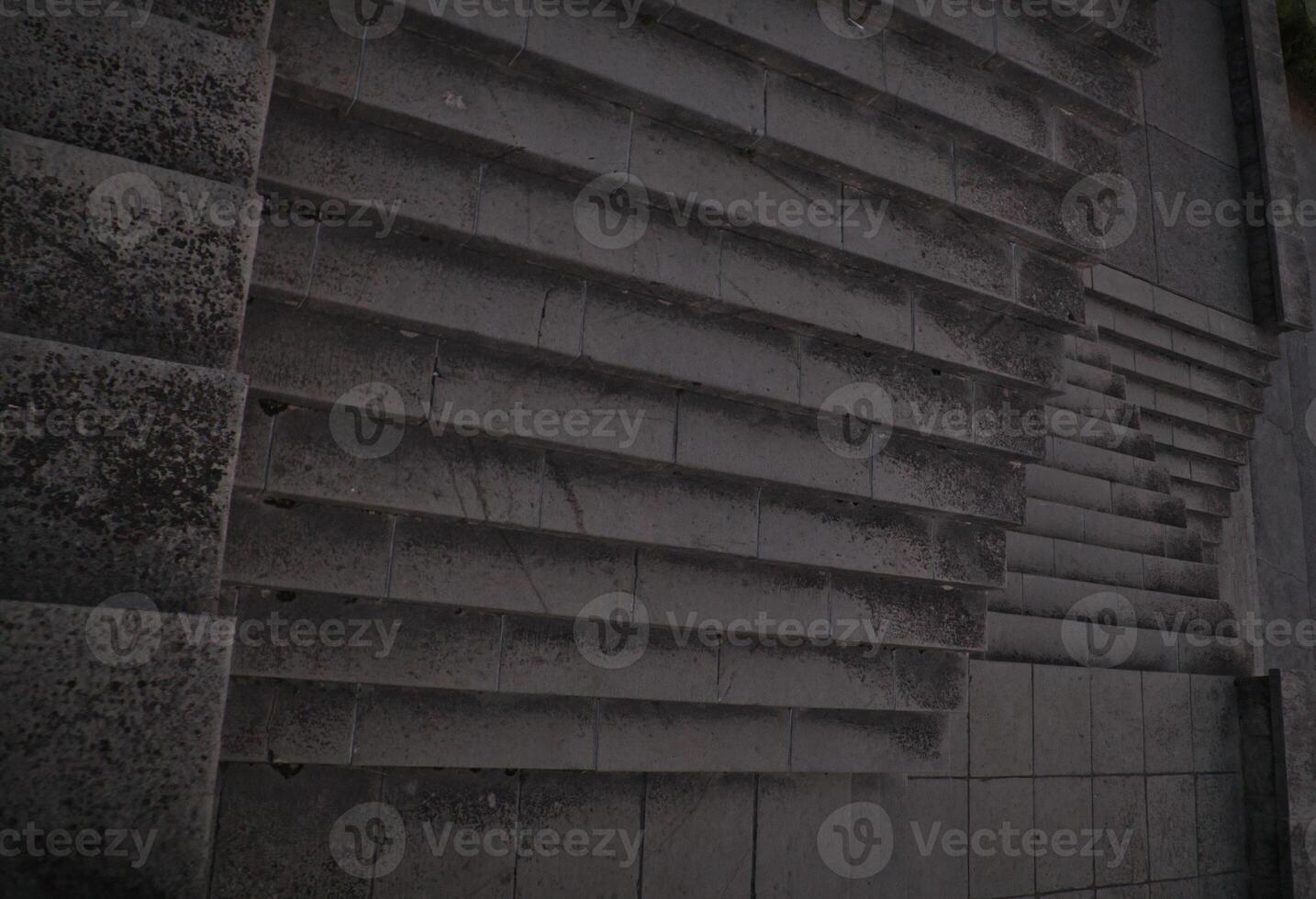 Staircase pattern with concrete steps provide a striking and textured background that is perfect for various design projects, presentations and artistic creations a perfect background. photo