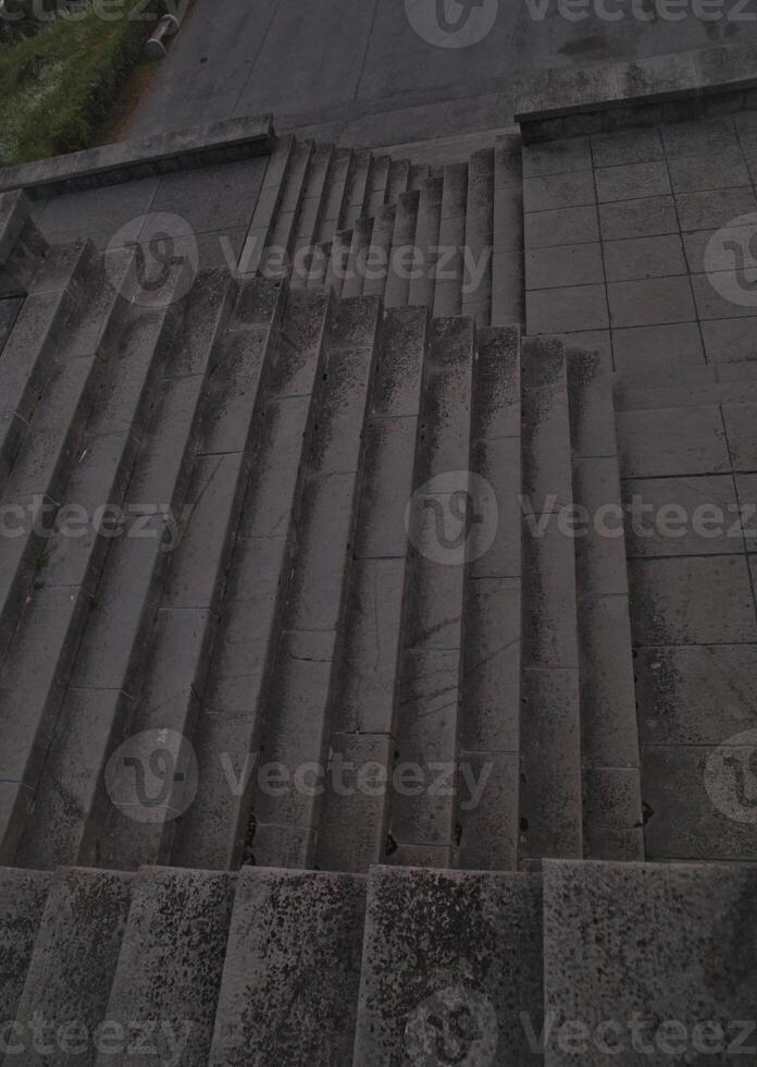 Staircase pattern with concrete steps provide a striking and textured background that is perfect for various design projects, presentations and artistic creations a perfect background. photo