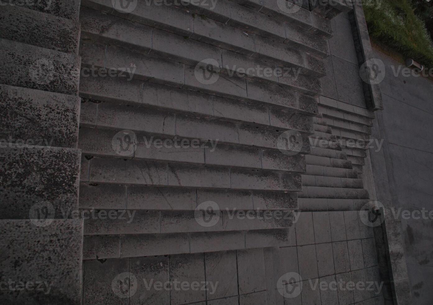 Staircase pattern with concrete steps provide a striking and textured background that is perfect for various design projects, presentations and artistic creations a perfect background. photo