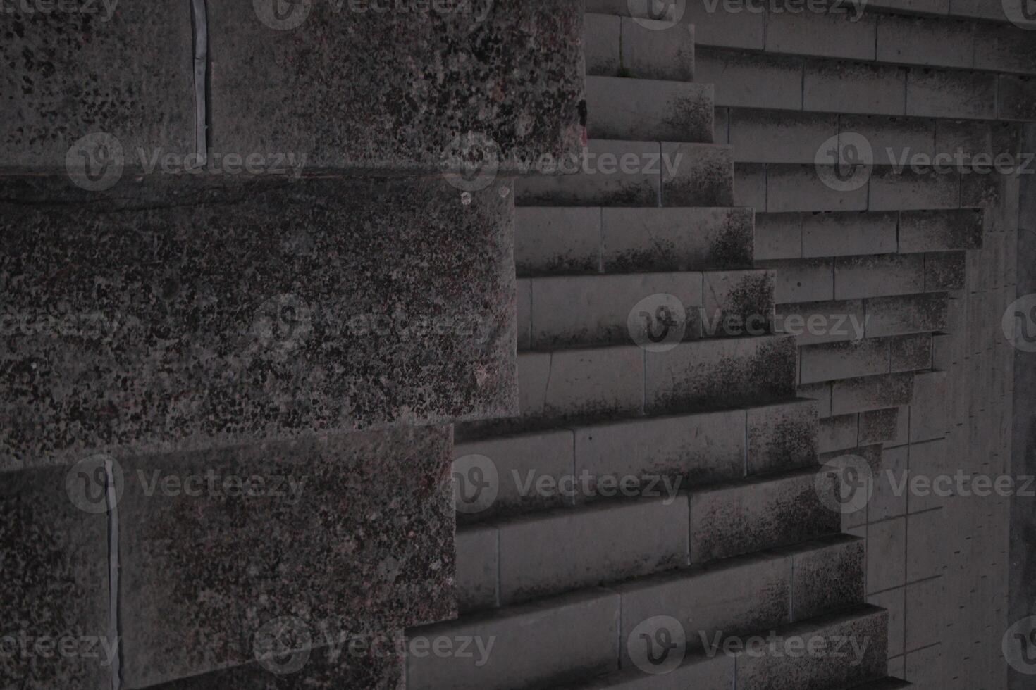 Staircase pattern with concrete steps provide a striking and textured background that is perfect for various design projects, presentations and artistic creations a perfect background. photo