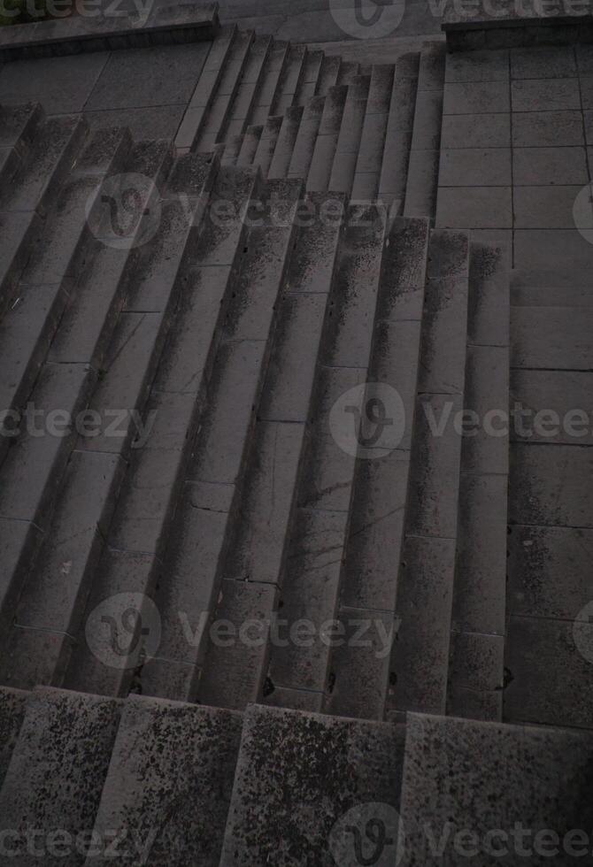Staircase pattern with concrete steps provide a striking and textured background that is perfect for various design projects, presentations and artistic creations a perfect background. photo