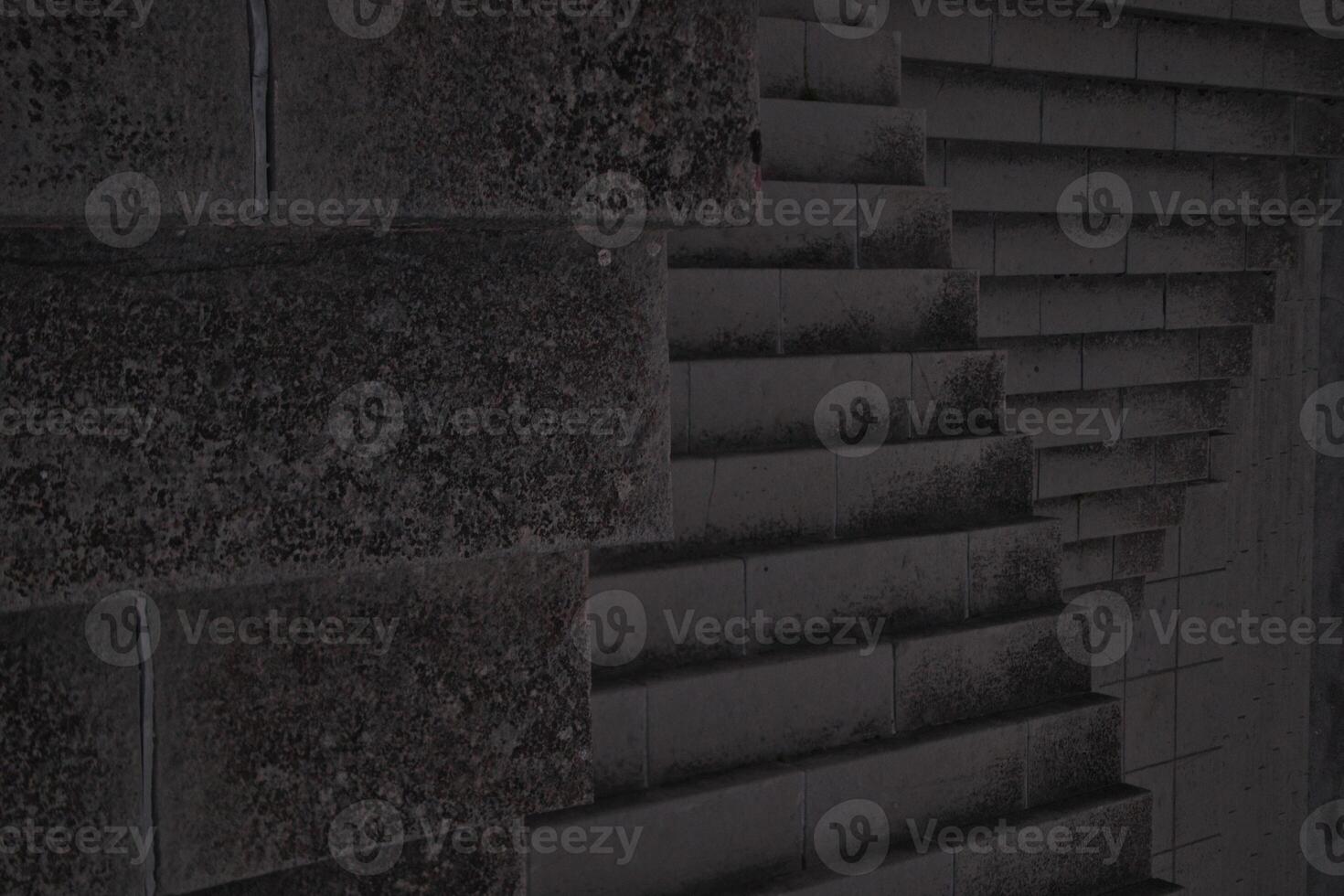 Staircase pattern with concrete steps provide a striking and textured background that is perfect for various design projects, presentations and artistic creations a perfect background. photo