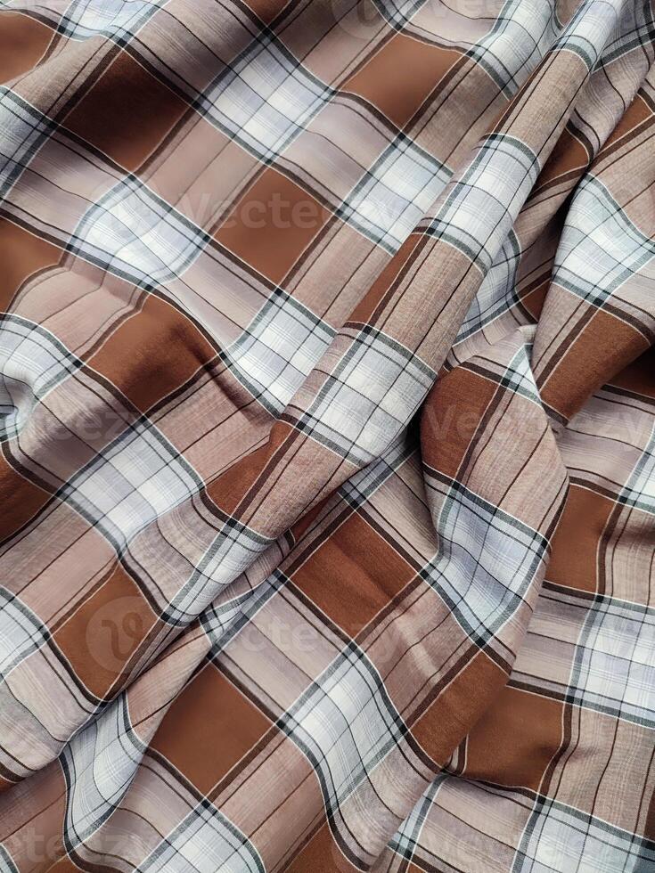 Layered fabric plaid tartan, textile fabric texture. Custom check seamless pattern background photo