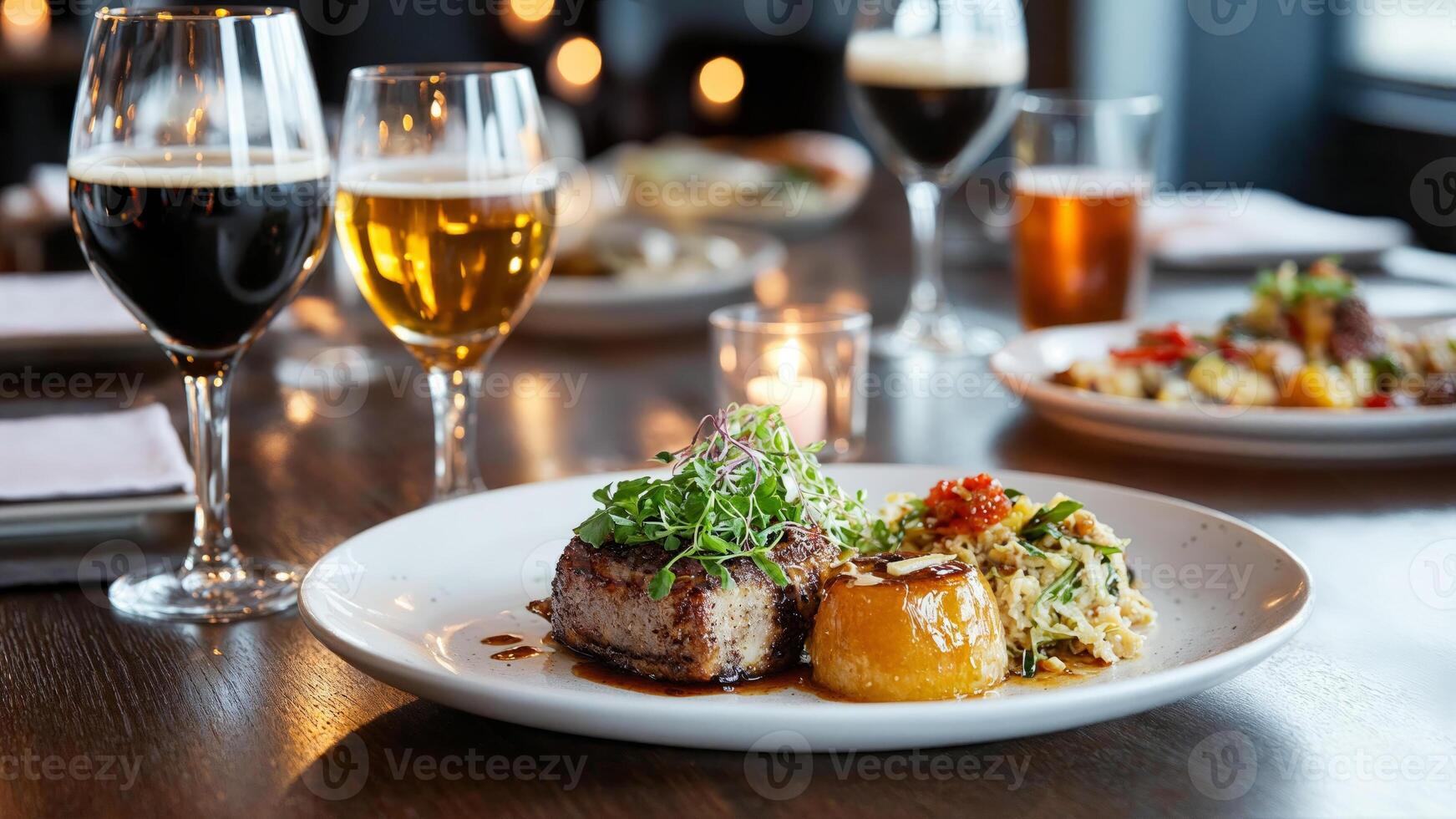 Enjoy a delicious gourmet meal paired with craft beers in a cozy and inviting restaurant setting photo