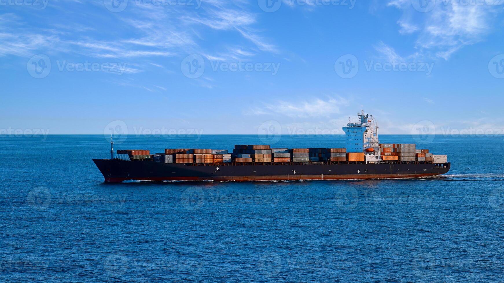 International commerce container cargo ship delivering freight shipment across the ocean photo