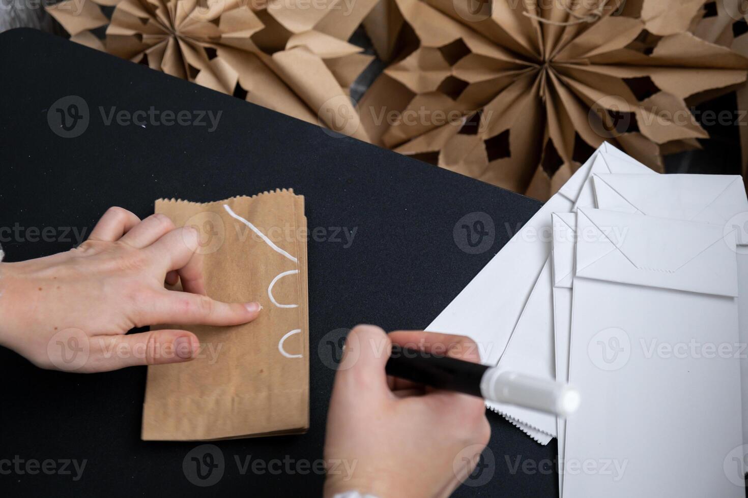 Master class of making craft paper snowflakes for conscientious Christmas decor. Sustainable celebration minimal responsible DIY holiday project. Step by step instruction photo