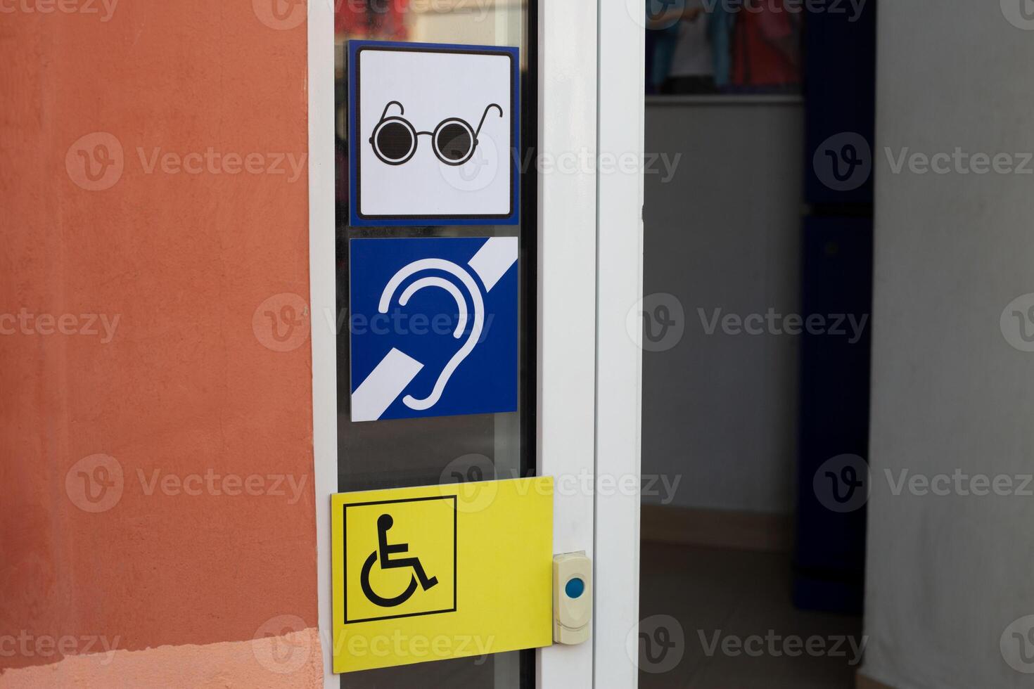 Signs for deaf people and for blind people with disabilities. Accessible environment for people with disabilities on the face of the city, assistance before entering the building for elderly people photo