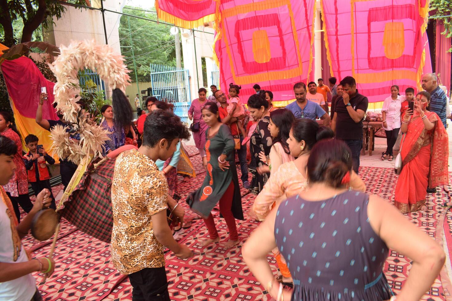 Delhi, India, July 02,2024 - Devotees performing spiritual dance in front of Durga Idol, Durga Puja celebration at Kali Bari temple in Jhilmil Colony Delhi, Durga utsav festival in Oct 2023 photo