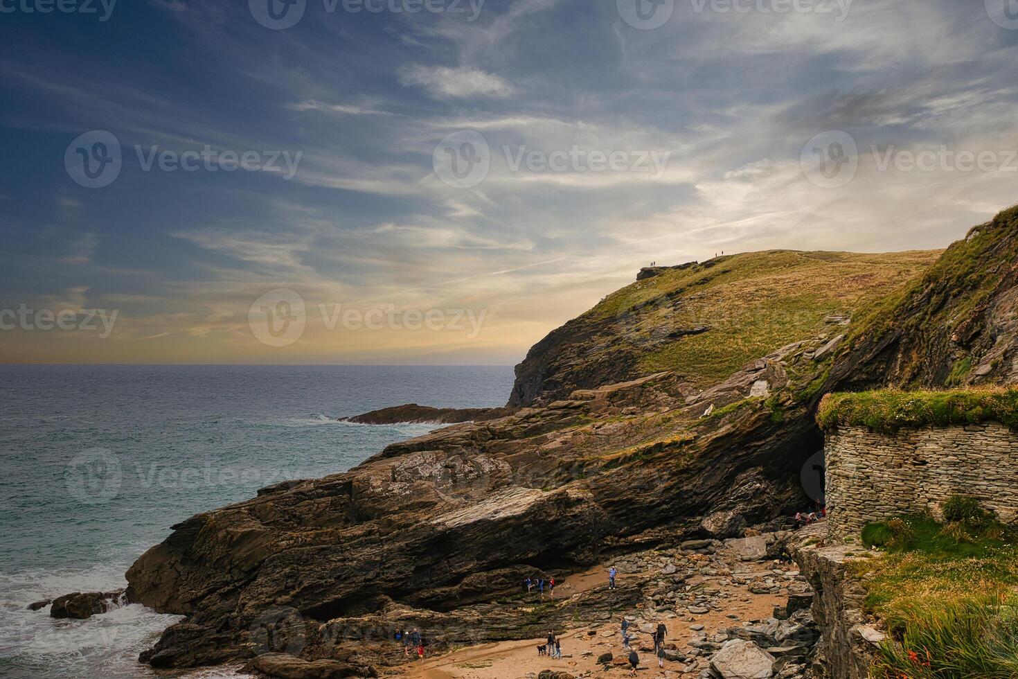 Scenic Coastal View with Rocky Cliffs and Beach in Tintagel, Cornwall, UK photo