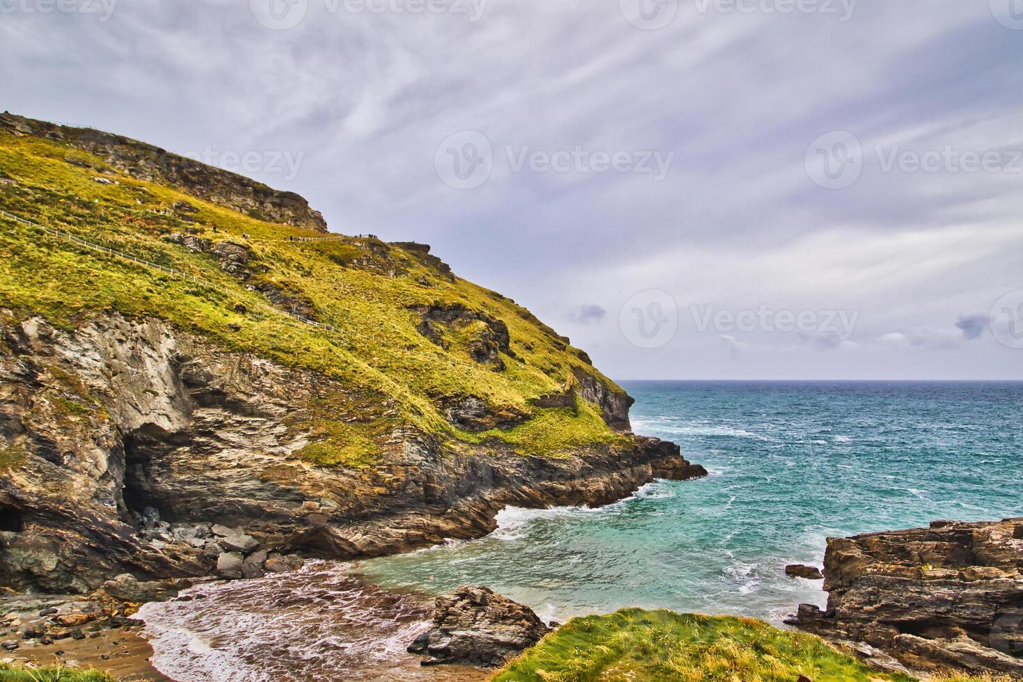 Serene Coastal Landscape with Rugged Cliffs in Tintagel, Cornwall, UK photo