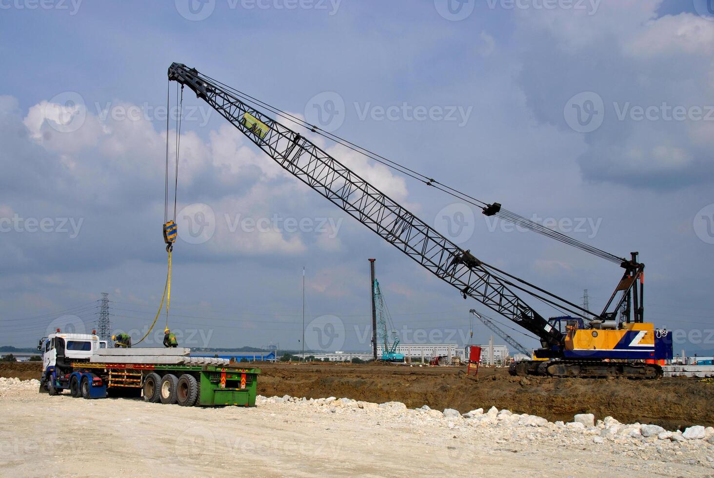 Concrete pile construction of new building at construction site. Square pile foundation for soil photo