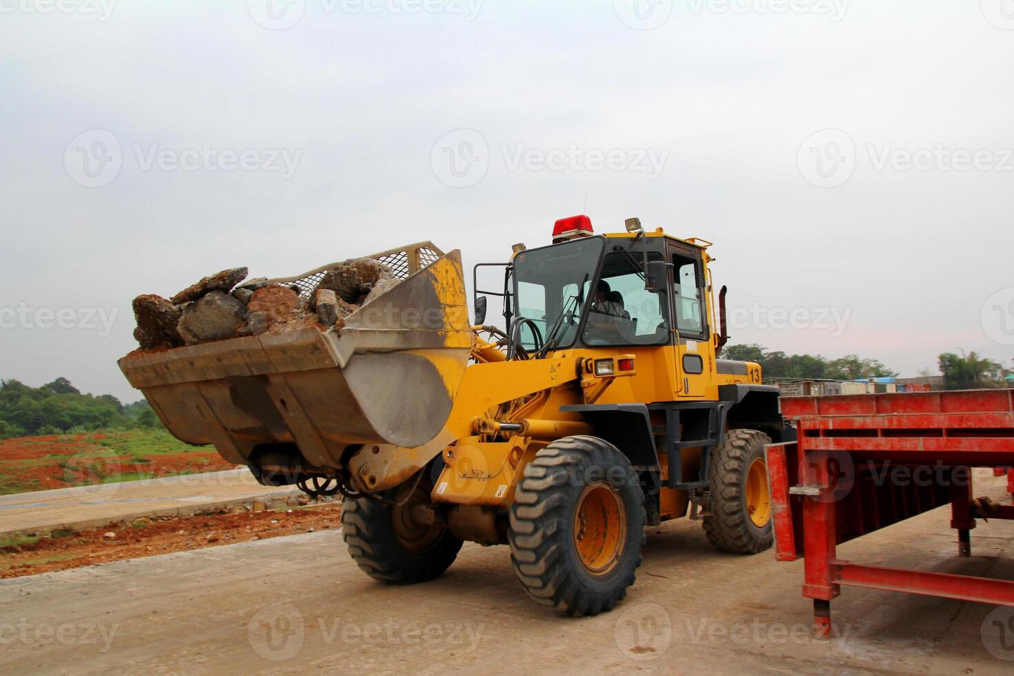 Bulldozer loader machine during earthmoving.Heavy equipment machine on construction site photo