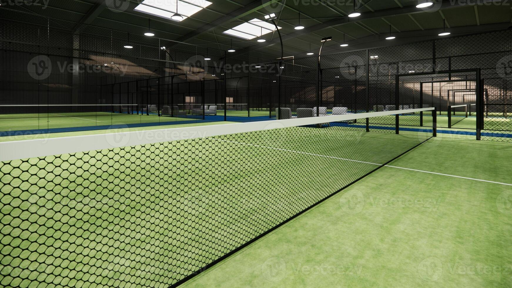 Closeup Padel Paddle tennis net on green surface. inside hangar building photo