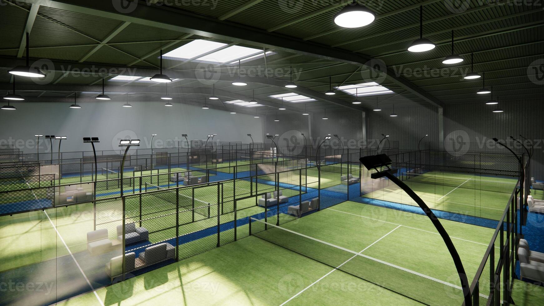 aerial view on a padel court with greenflooring and glass that serve as walls inside hangar building photo