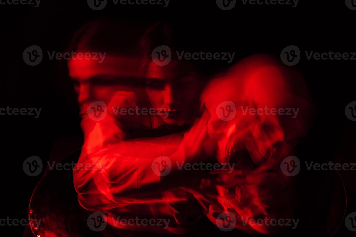 blurry scary portrait of a witch ghost girl in a white shirt photo