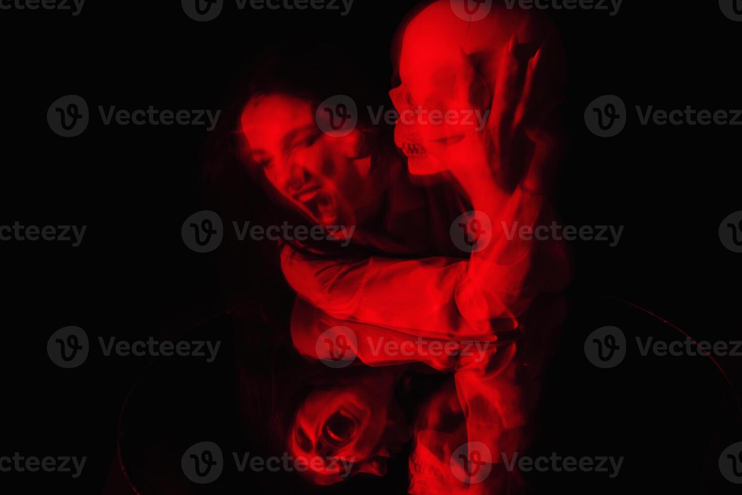 blurry terrible portrait of a ghost witch girl with a dead man's skull photo