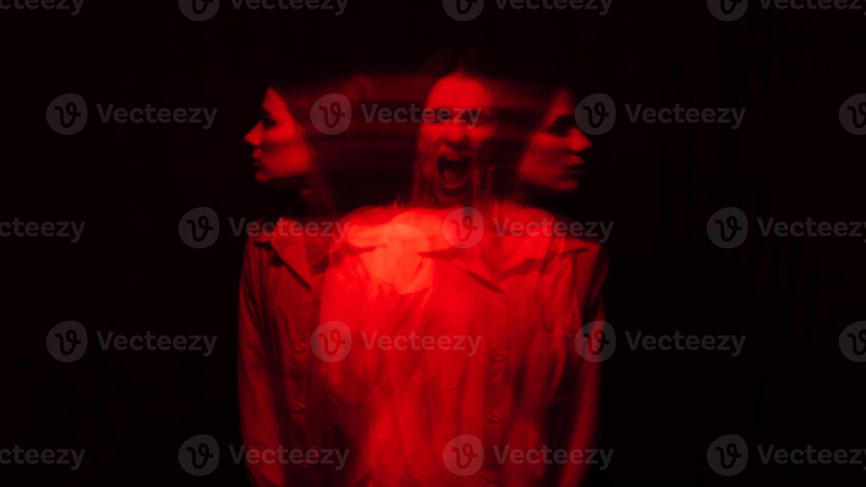 A girl in a chair on a red background with a blur photo