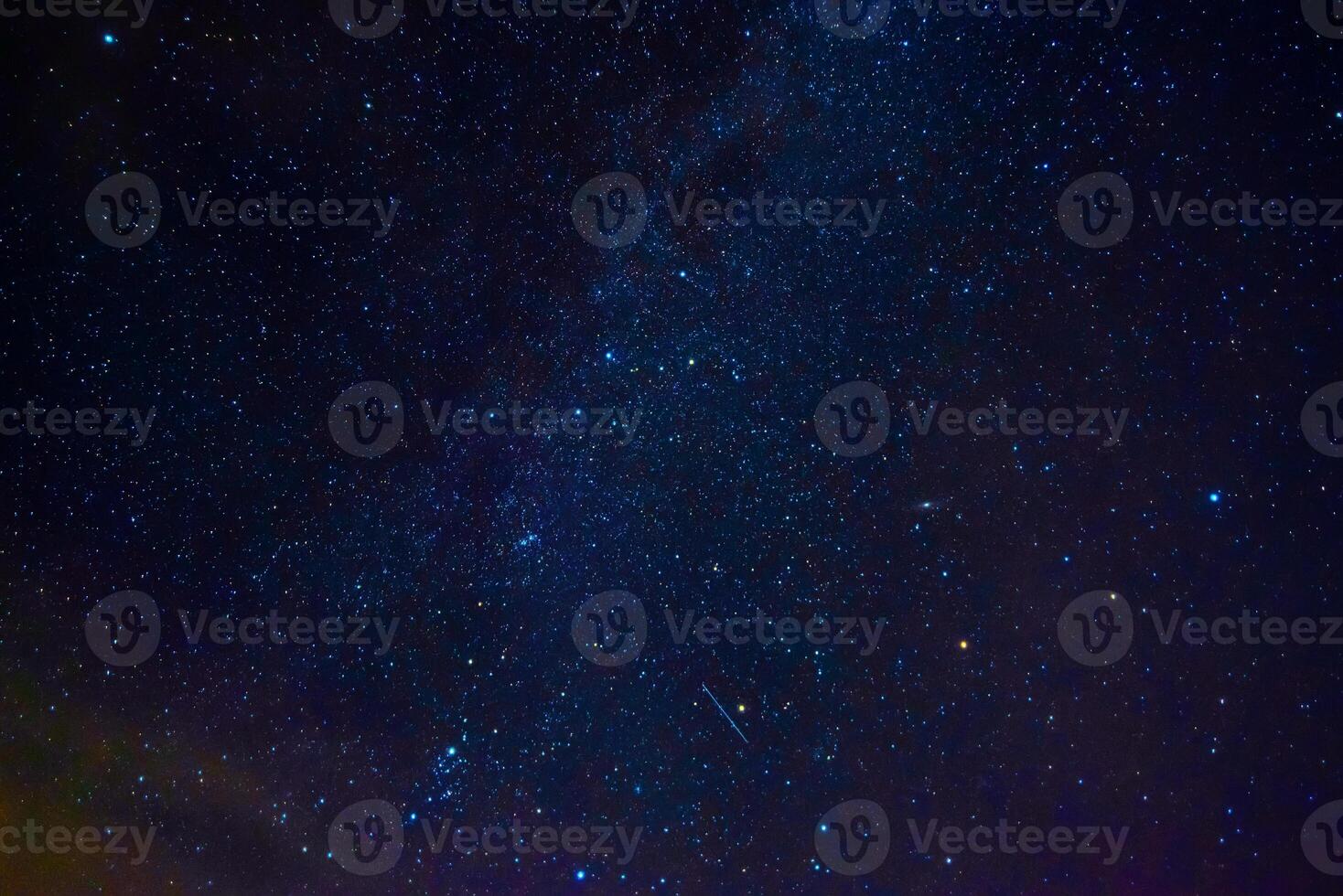 Astrophotography of dark blue starry sky with many stars, nebulae and galaxies photo