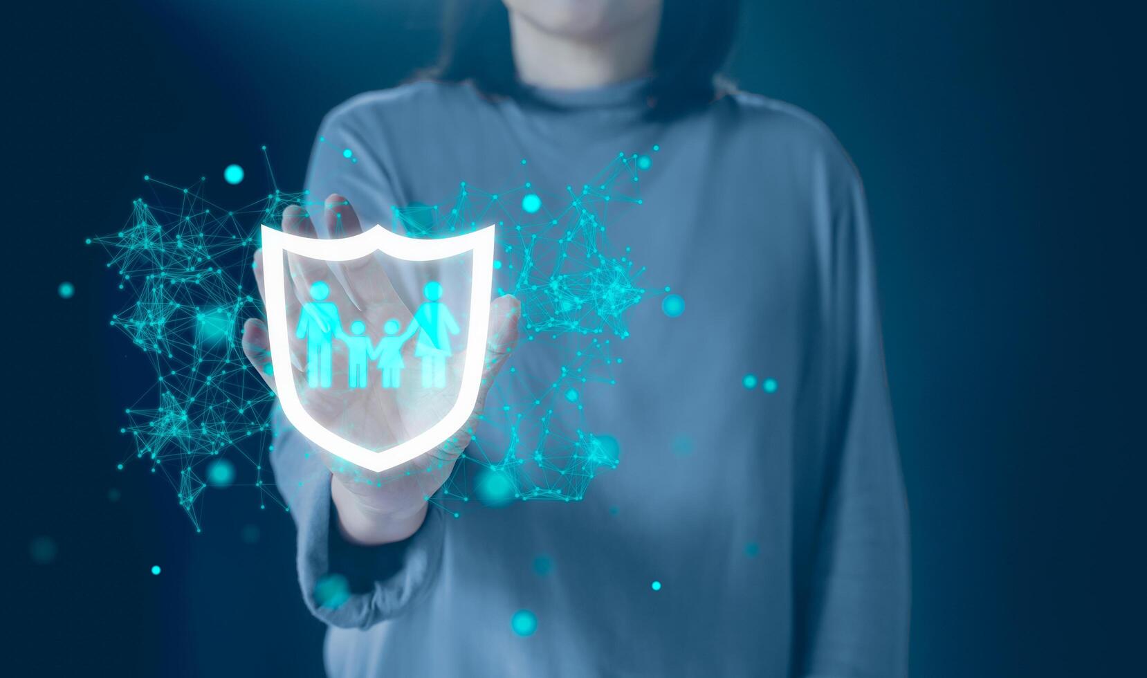 Woman hold protective gesture sign of shield with group of people, family members icon inside. The concept of insurance, protection of the family, life and health insurance. photo