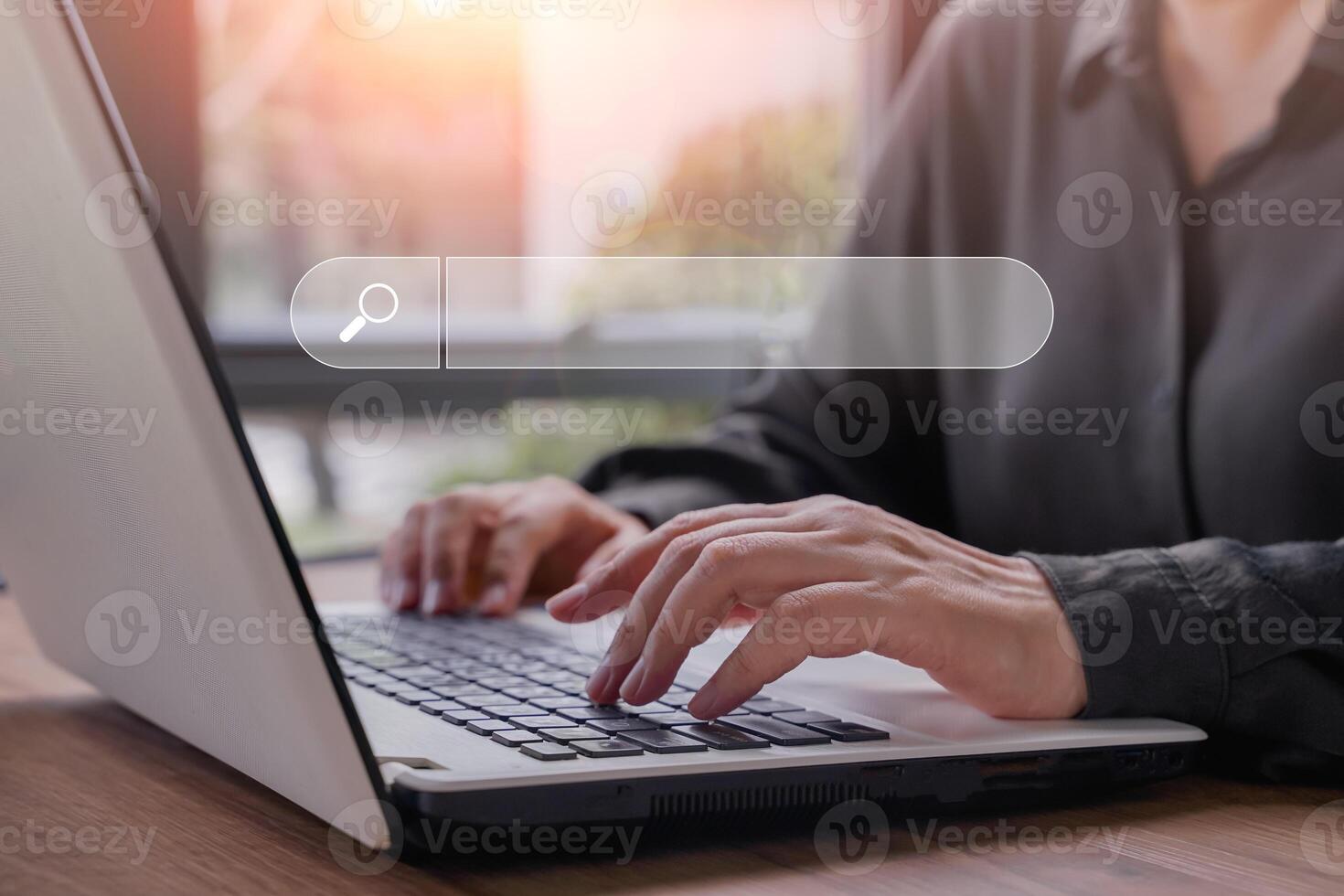 Hand of businessman searching, browsing internet data information with blank search bar. Search Engine Optimization SEO Networking Concept.Businesswoman working with computer laptop on desk in office. photo